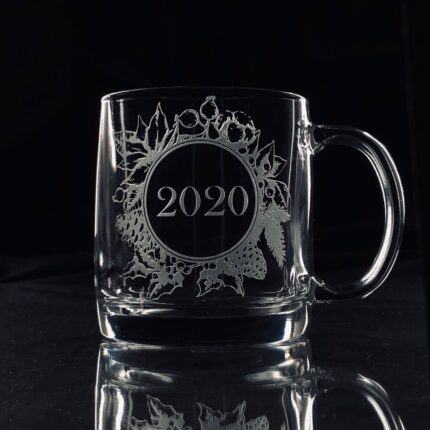A personalized Christmas mug with a custom engraved message, filled with hot cocoa and marshmallows.