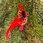 Aurora the Female Northern Cardinal Christmas ornament with tan and red rubber bands and a fluffy tail.