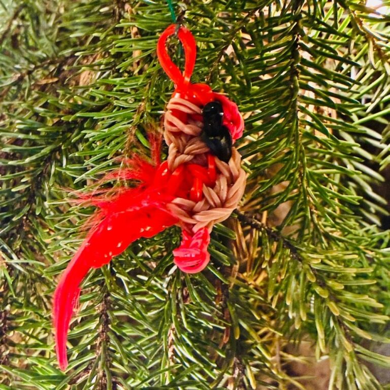 Aurora the Female Northern Cardinal Christmas ornament with tan and red rubber bands and a fluffy tail.