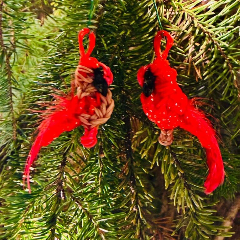Male and Female Northern Cardinal couple Christmas ornaments, Borealis and Aurora, made from red and tan rubber bands with fluffy tails.