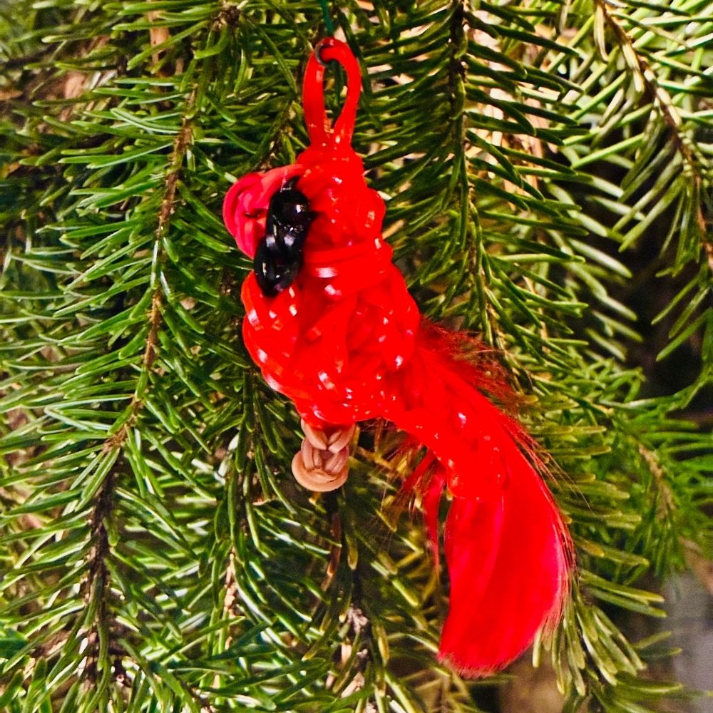 30 Borealis the Male Northern Cardinal Christmas ornament with red rubber bands and a fluffy tail, perched on a branch.