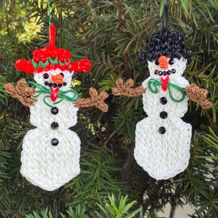 Mr. and Mrs. Snow Christmas ornament set featuring Flurry the Snowman and Tundra the Snowlady, made from rubber bands.