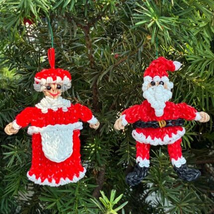 Santa and Mrs. Claus Christmas ornament set made from rubber bands, displayed together on a tree branch.