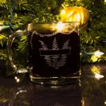 A personalized Christmas mug with a custom engraved message, filled with hot cocoa and marshmallows.