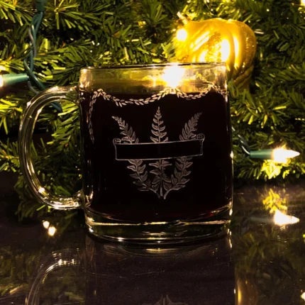 A personalized Christmas mug with a custom engraved message, filled with hot cocoa and marshmallows.