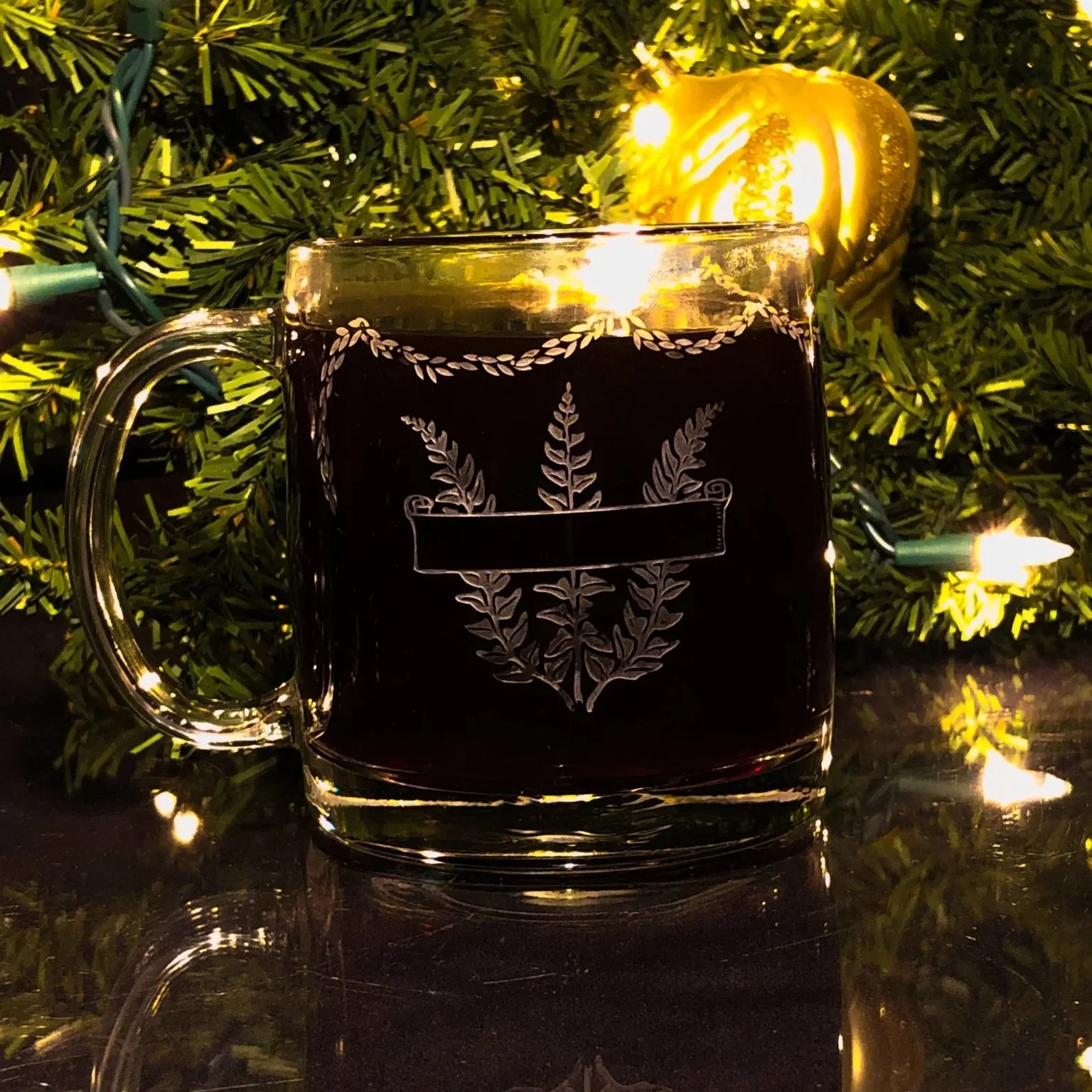 papa-bear-warm-beverage-mugcrystal-housecrystal-house-7515916 A personalized Christmas mug with a custom engraved message, filled with hot cocoa and marshmallows.
